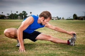 An athlete warming up at the track before his run.