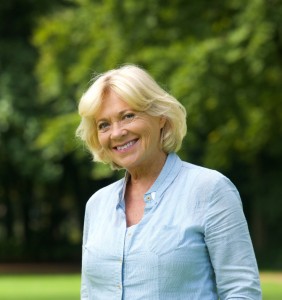 Close up portrait of a smiling senior woman outdoors